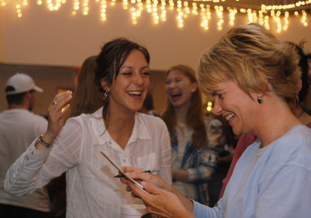 Director of Residence Life Kathy Southall takes Sarah Anderson's order during the annual residence life coffee house Mochafee.