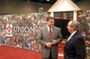 Union University President David S. Dockery talks with a visitor at the Union booth during the Southern Baptist Convention. - Photo by Brad Moore
