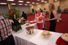 Theology graduate Kelly Krebs enjoys food and fellowship at the Graduates' Reception. - Photo by Morris Abernathy