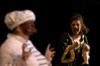 Senior Ashley Mitchell gasps in terror as Lindsey Young's character declares his love for her in <i>The Battle of Dim Wits</i>. - Photo by Kristen Nicole Sayres