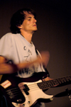 DMS major Tyler Malone reverently plays his bass guitar during a song in Greenwood's final concert at Union. - Photo by Kathleen Murray