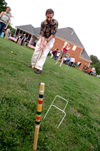 Graduating Senior Michael Keiffer take a croquet shot during the Young Alums' Happy Trails social at the Dockery's. - Photo by Jonathan Blair