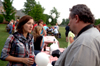 Enrollment Counselor Lisa Whiffen and University Photographer Morris Abernathy chat during the Young Alums' Happy Trails social at the Dockery's. - Photo by Jonathan Blair