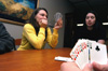 02/3/05 - Lorien Pirtle and Jessica Humphreys concentrate on a grueling game of Go Fish in Hurt Commons after returning from the winter break.
