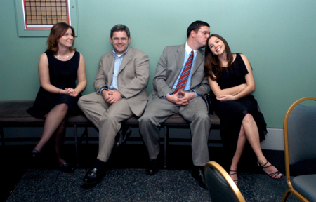 Brandon Boylan, assistant director of wellness, and Neal Rager, coordinator of student leadership development, spend time with their wives, Rachel and Erin, while chaperoning the Cardinal Ball.