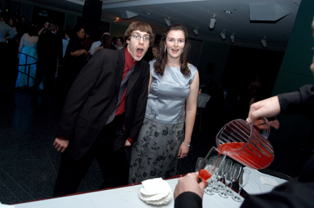 Seniors Kevin Minister and Meredith Williams go for some punch during the Cardinal Ball at the Brooks Museum of Art in Memphis.