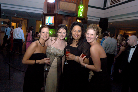 Sophomore E. J. Dufford, Freshman Meggan Prince, and Sophomores Lauren Washington and Ashley Abernathy pose for a group picture during the Cardinal Ball at the Brooks Museum of Art in Memphis.