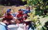 Residence Director Ema Wall gives the thumbs up before returning to the river with Broc Barnes, Jonathan Blair and Beth Pierce during Adventure Programs' white water rafting trip. - Photo by Cam Tracy