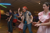 Lindey Abell, Carson Turner, Melody Pickerill, Sally Goulooze and others all bust a move on the skating rink floor at the SAC sponsered 80s Skate Night. - Photo by Jonathan Blair