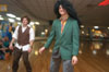 Tyson Cadenhead (right) dons some major hair during 80s Skate Night. - Photo by Jonathan Blair