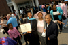 8/6/05 - Master of Education graduate Jannina Gaston poses with friends and family after receiving her degree at summer graduation. - Morris Abernathy