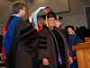 Randy Shadburn and Carla Sanderson confer the doctor of education degree upon Linda Bowman Campbell, a principal in the Memphis area.  Twenty-two students received their doctor of education degrees. 
 - Photo by Morris Abernathy