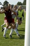 08/20/05 - Senior Lendy Wilson fights for position, while Nikki Burau also pursues the ball.