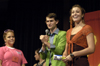 Sophomore Ronald Long leads Katie Morgan and Lindsey Gaines in a game at the SAC Game Show during New Student Orientation. - Photo by Kathleen Murray