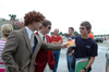 08/27/05 - Daniel Holsinger and Scott Griffin hand out goody bags to freshmen while making a LIFE Group video during Freshman move-in day. - Kristen Nicole Sayres