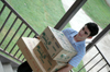 08/27/05 - Ben Farrow of Jonesborough, Tenn. carries a load of belongings to his room during Freshman Move-In Day.