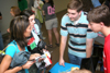 08/30/05 - Tyler Whetstone (center) & Cam Armstrong (right) enlightens Kristmar Rawlins & Stephanny Rodriquez about GO Trips at the Student Life Fair during New Student Orientation. - Kyle Kurlick