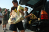 09/5/05 - Sophomore Sarah Santiago helps unload donated goods to be taken to West Jackson Baptist Church. - Brad Moore