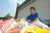 09/5/05 - Senior Brett Logan sorts through goods collected by Union students before delivering them to West Jackson Baptist Church to assist with Hurricane Katrina victims. - Brad Moore