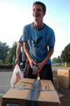 09/5/05 - Freshman Christian Christensen prepares boxes to be used for delivering donated goods to West Jackson Baptist Church to assist Hurricane Katrina victims. - Brad Moore