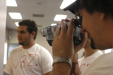 Sophomore Aaron Hardin shoots footage for the season's third episode of <i>uBuzz</i> as Ryan Sidhom tries to recruit a new member the fictitious fraternity <i>Upsilon Beta Zeta.</i>