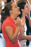 09/23/05 - Sophomore Sarah Nadaskay and Junior Lori Cunningham worship during a chapel service. - Brad Moore