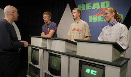 Mark Inman, Casey Yates and Rachel Lovell interact with host Steve Beverly during a practice run of the Head2Head gameshow.
