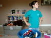 Senior Jessica Cherry contemplates what to do next while helping clean and organize the house of a mother and her three children during the Day of Remembrance. - Photo by Brad Moore