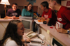 11/7/05 - Sophomore Kristin Jennings enjoys some fellowship with friends while she works as a resident assistant in the McAfee Commons.