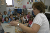 Cindy Kahler, department secretary, spent her Day of Remembrance at Jackson Christian School reading to children. - Photo by Kathleen Murray