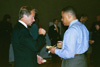 Steve Arendall, director of the MBA program in Germantown, speaks with MBA student Joel Nichols at the Germantown Five Year Anniversary Reception. - Photo by Sara Horn