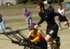 Freshman SAE Brian Bodnarchuk pulls Freshman Chi Omega Claire Yates during the chariott races at the Greek Olympics. - Photo by Kathleen Murray