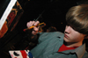 Freshman Lukas Burke paints as random music plays in the background during an interlude at Cafe Bongo. - Photo by Brad Moore