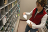 On-campus jobs offer students a wide variety of opportunities to utilize their talents and earn money. Junior Tobey Mann, nursing major, sorts and delivers mail in the university’s post office. - Photo by Brad Moore