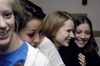 12/2/05 - Jessica Reed, Brynn Miller, Sarah Eastin, & Christina Pool enjoy themselves at a dorm room Christmas party.