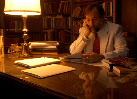 8/31/2005 - Dr. Hal Poe, Charles Colson Professor of Faith and Culture, reviews some papers in his office. (ID: 4335)