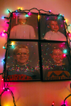 12/5/05 - Jonathan Giles, Chris Hayden, Noah Sterns, and Brent Jones reflect their childlike joy for Christmas with a colorfully decorated dorm room.