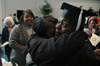 Broadcasting Graduate Brandy Transou weeps for joy while celebrating with her family following the fall graduation ceremony. - Photo by Brad Moore