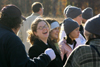 Senior Annie Ross and Sophomore Josh Clarke enjoy a laugh during the Turkey Bowl while Junior Keely Hart and Sophomore Bekah McElhannon watch the excitement on the field. - Photo by Kyle Kurlick