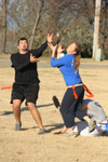 Sophomores Stephen Ellis and Jessica Ramsay both go for the bird during the Young Alums' Turkey Bowl. - Photo by Kyle Kurlick