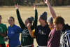 Sophomores Jessica Ramsay, Carly Ford, Cameron Armstrong, Devin Maddox, and Senior Luke Pruett cheer during the Young Alums' Turkey Bowl. - Photo by Kyle Kurlick