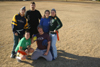 Sophomores (first row) Lindsey Wallach, Devin Maddox,
(back row) Cameron Armstrong, Stephen Ellis,  Jessica Ramsay, and Carly Ford pose with the bird shortly after the Young Alums' Turkey Bowl. - Photo by Kyle Kurlick