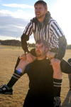 Senior Luke Pruett gets a better view of the game with the help of sophomore Stephen Ellis during the Young Alums' Turkey Bowl. - Photo by Kyle Kurlick