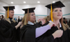 Suzanne Fitzpatrick, Cheslea Crowson and Crystal Gibson make final preparations before Fall Graduation 2005. - Photo by Kristen Nicole Sayres