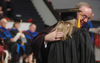 Encouragement and love in hug from President Dockery during Fall Graduation 2005. - Photo by Kristen Nicole Sayres