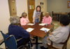 01/16/06 - Julie Bradfield, director of student ministries, spends time with patients at Mission Convalescent Home in Jackson on Martin Luther King, Jr. Day. - Morris Abernathy