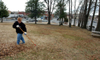 Phyllis Davenport, coordinator of campus events, rakes leaves at the Mission Convalescent Home in Jackson during Martin Luther King, Jr. Day. - Photo by Morris Abernathy