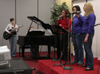 02/7/06 - Women lead in praise and worship at the first Klemata large group meeting of the spring. - Stephanny Rodriguez