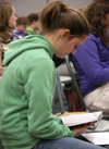 02/7/06 - Angela White digs into the Word at the first Klemata large group meeting of the spring. - Stephanny Rodriguez