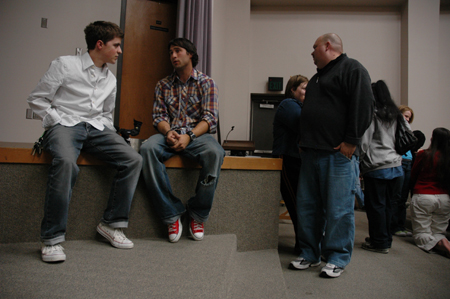Freshman Matt Elia speaks with one of the filmmakers after the Union showing of <em>Invisible Children</em>.
